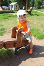 Lovely baby on teeter-totter in summer