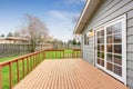 Lovely back yard with deck and grass. Royalty Free Stock Photo