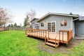 Lovely back yard with deck and grass. Royalty Free Stock Photo