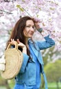 Lovely Beautiful Caucasian Woman Standing Posing on the Background of Blooming Japan Cherry Royalty Free Stock Photo