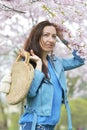 Lovely Beautiful Caucasian Woman Standing Posing on the Background of Blooming Japan Cherry Royalty Free Stock Photo