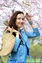 Lovely Beautiful Caucasian Woman Standing Posing on the Background of Blooming Japan Cherry Royalty Free Stock Photo