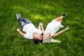 The lovely couple in love sitting on green grass. Royalty Free Stock Photo