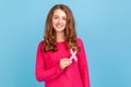 Woman holding pink ribbon, breast cancer awareness, female health diagnostics and cancer prevention. Royalty Free Stock Photo