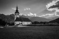 Black and white picture of Church of The Assumption of The Virgin Mary, Bitnje, Slovenia, Europe Royalty Free Stock Photo