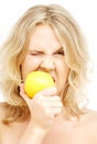 Lovely blond biting lemon Royalty Free Stock Photo