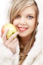 Lovely blond in fur with apple