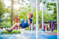 Lovely blond little boy on a swing in the park. Adorable boy having fun at the playground Royalty Free Stock Photo