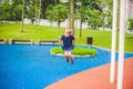 Lovely blond little boy on a swing in the park. Adorable boy having fun at the playground Royalty Free Stock Photo