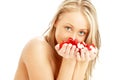 Lovely blond in spa with red and white rose petals Royalty Free Stock Photo