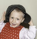 Blond child smiling to the camera