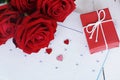 Lovely blooming red color rose flower and elegant gift box on 14 Fab calender background decorated with red ribbon, sweet Royalty Free Stock Photo