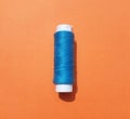 Blue  yarns  on the orange  background. Royalty Free Stock Photo