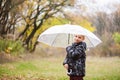 Lovely boy hold umbrella at autumn park Royalty Free Stock Photo