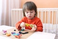 Lovely boy with playdough