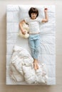 Lovely boy relaxing with his teddy bear Royalty Free Stock Photo