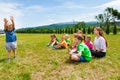 Lovely boy standing in front of group of kids Royalty Free Stock Photo