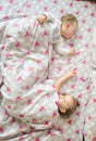 Lovely brother and sister sleeping in bed at home. Concept of Brother And Sister Together Forever Royalty Free Stock Photo