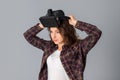 Lovely brunette girl testing virtual reality glasses Royalty Free Stock Photo