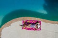 A Lovely Brunette Swimsuit Model Enjoys Her Holiday At The Pool Royalty Free Stock Photo