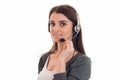 Lovely brunette woman working in call center with headphones and microphone looking at the camera and smiling isolated Royalty Free Stock Photo