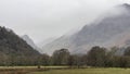 Lovely calm Winter morning landscape image of view across Manesty Park towards Castle Crag in the background