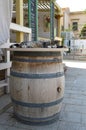 A Lovely Cat is Sleeping on a Barrel