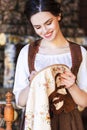 Lovely Caucasian Brunette Woman Posing With Fancywork Hoop in Retro Dress In Rural Environment