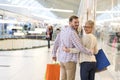 Lovely Caucasian couple doing shopping in a shopping centre Royalty Free Stock Photo