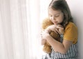 Lovely caucasian girl holding teddy bear,child with toy,smiling happy kid portrait indoors.Happy childhood.Relationship and Royalty Free Stock Photo