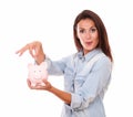Lovely charming woman with her piggybank