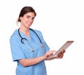 Lovely charming young nurse with tablet pc Royalty Free Stock Photo