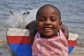 Lovely child with boat smiling