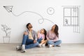 Lovely child girl and her young parents dreaming about their new home with sketch interior drawings against white wall Royalty Free Stock Photo