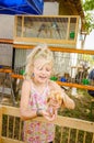 Lovely child holding a duckling Royalty Free Stock Photo