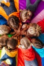 Cheerful children playing team building games on a floor Royalty Free Stock Photo