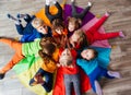 Cheerful children playing team building games on a floor Royalty Free Stock Photo