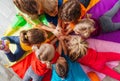 Cheerful children playing team building games on a floor Royalty Free Stock Photo