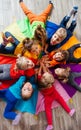 Cheerful children playing team building games on a floor Royalty Free Stock Photo