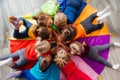 Cheerful children playing team building games on a floor Royalty Free Stock Photo