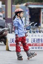 Lovely Chinese girl practicing inline skating, Guangzhou, China