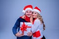 Lovely christmas couple holding presents