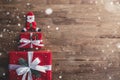 Lovely Christmas holiday background with red gift boxes, Santa C