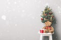 Lovely Christmas holiday background with red gift boxes, teddy