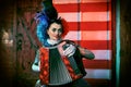 Lovely clown with accordion