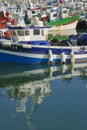 lovely colorful fishing boats in artisanal small fishing port