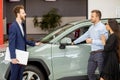 Lovely couple came to buy a new car in dealership