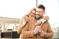 Lovely couple with cups of coffee on street in morning Royalty Free Stock Photo