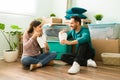 Lovely couple eating lunch on the living room floor Royalty Free Stock Photo