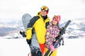 Lovely couple with equipment at resort. Winter vacation Royalty Free Stock Photo